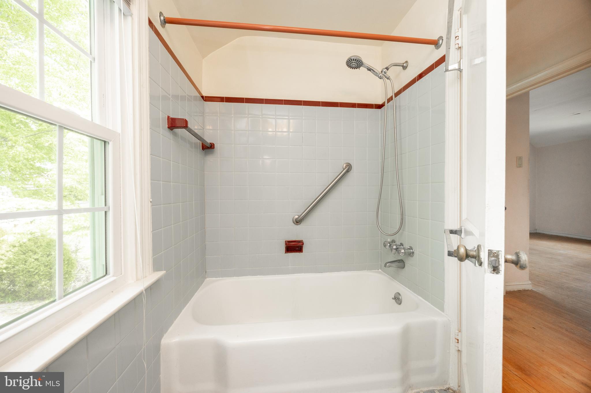 314 Spring Valley Road Springfield, PA 19064 - Photo 31 of 43 a bathroom with a white bath tub and a shower