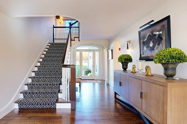 a dining room with furniture and wooden floor