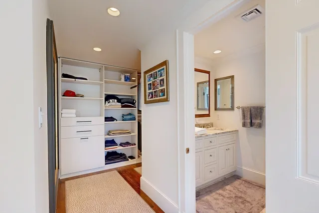 a view of cabinets a refrigerator and a sink