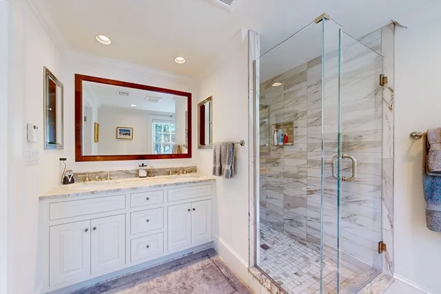 a bathroom with a double vanity sink mirror and double