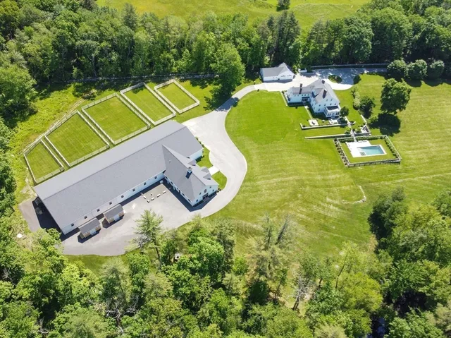 a view of a swimming pool and lounge chairs