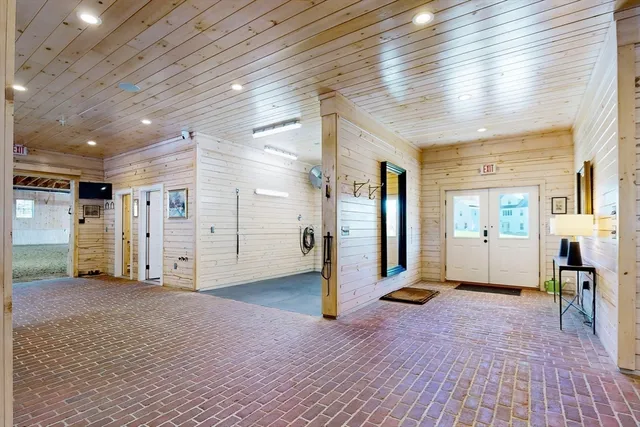 a view of a hallway with wooden floors