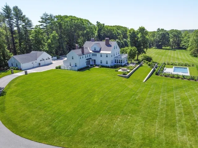 a aerial view of a house with a big yard