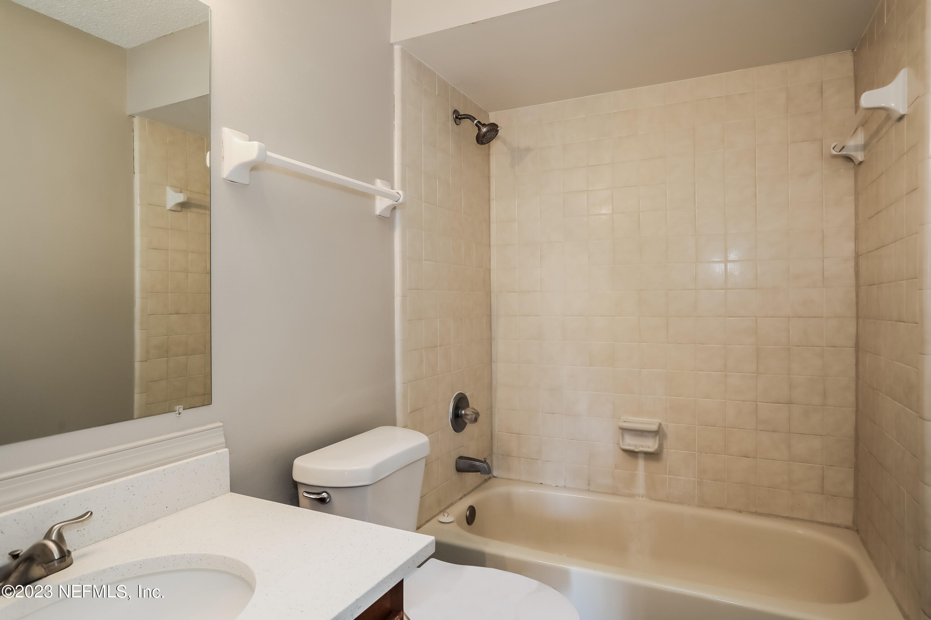 7684 Collins Ridge Boulevard Jacksonville, FL 32244 - Photo 12 of 15 a bathroom with a toilet and a bathtub
