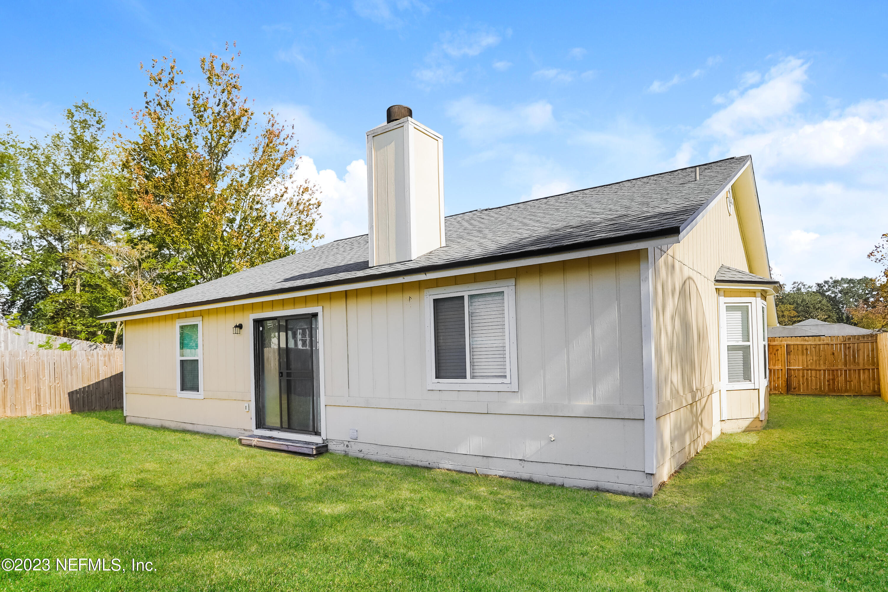 7684 Collins Ridge Boulevard Jacksonville, FL 32244 - Photo 15 of 15 a front view of a house with garden