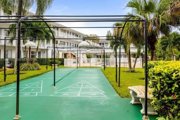 a view of a backyard with swimming pool