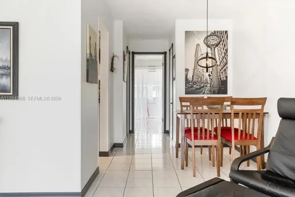 a view of a hallway with chairs