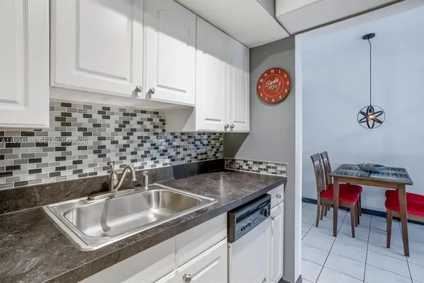 a kitchen with a sink and cabinets