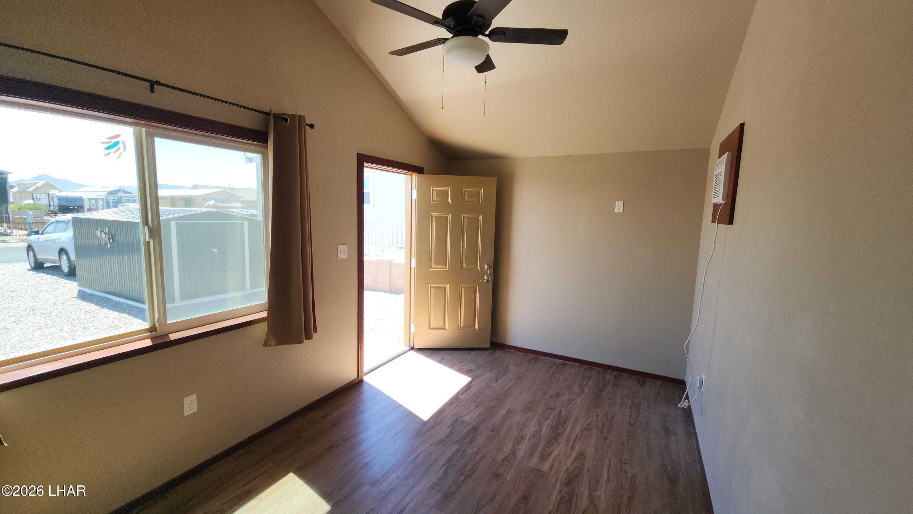 30 North Juniper Road Quartzsite, AZ 85346 - Photo 7 of 26 a view of empty room with wooden floor and fan