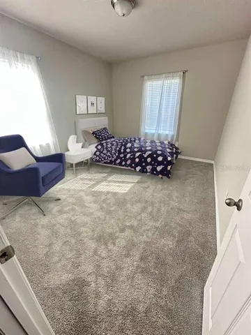 a view of livingroom with furniture and windows