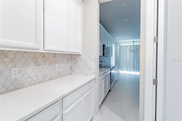 a hallway with cabinets