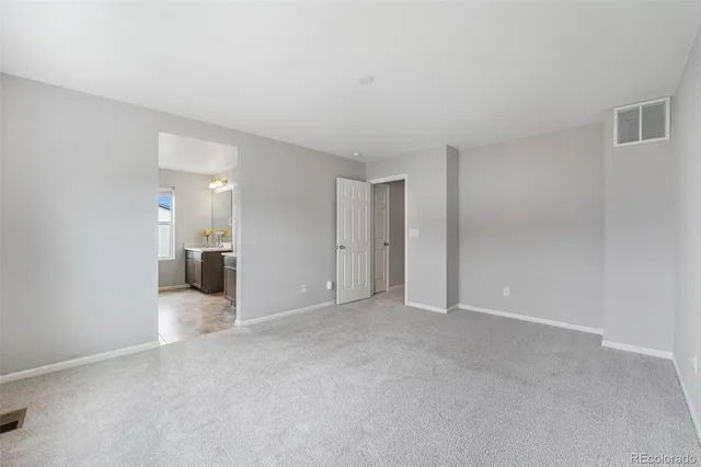 a view of a livingroom with a kitchen