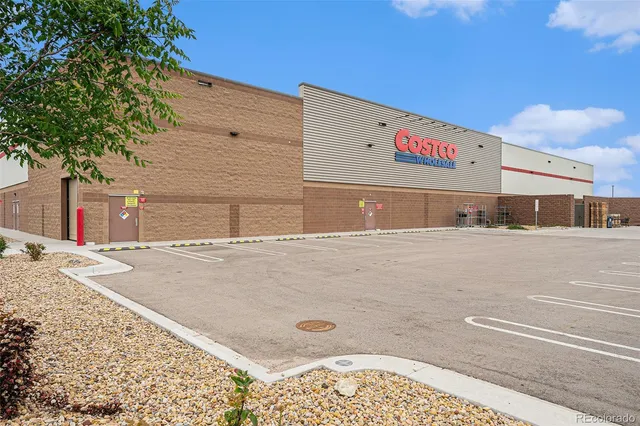 a view of a street with a building in the background
