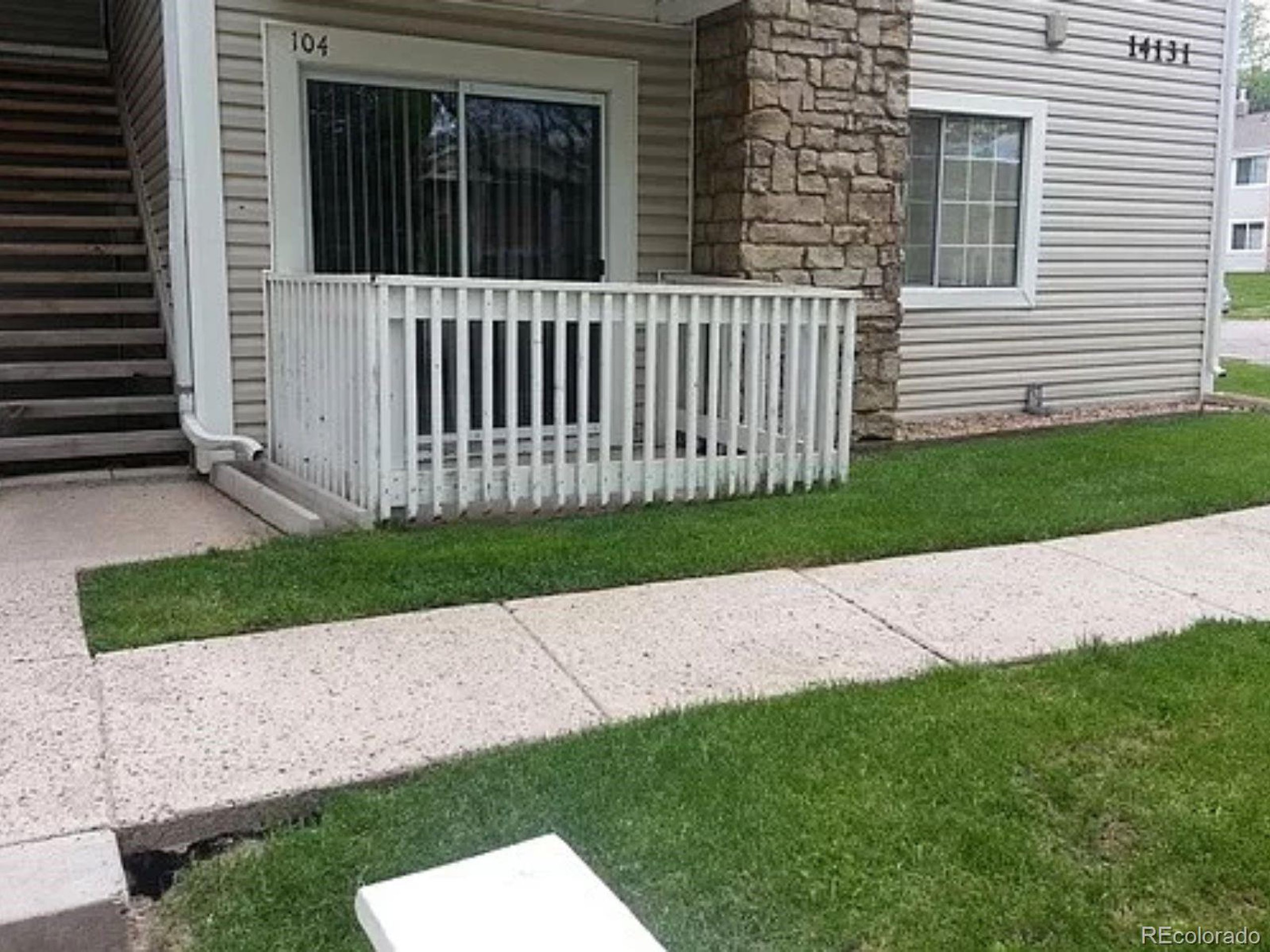 a porch with a yard