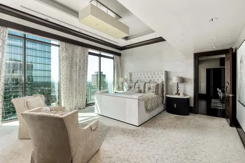 a living room with furniture and outdoor view