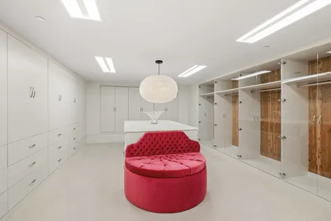 a dining hall with granite countertop a couch and chairs