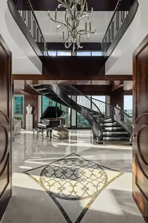 a view of a living room and chandelier