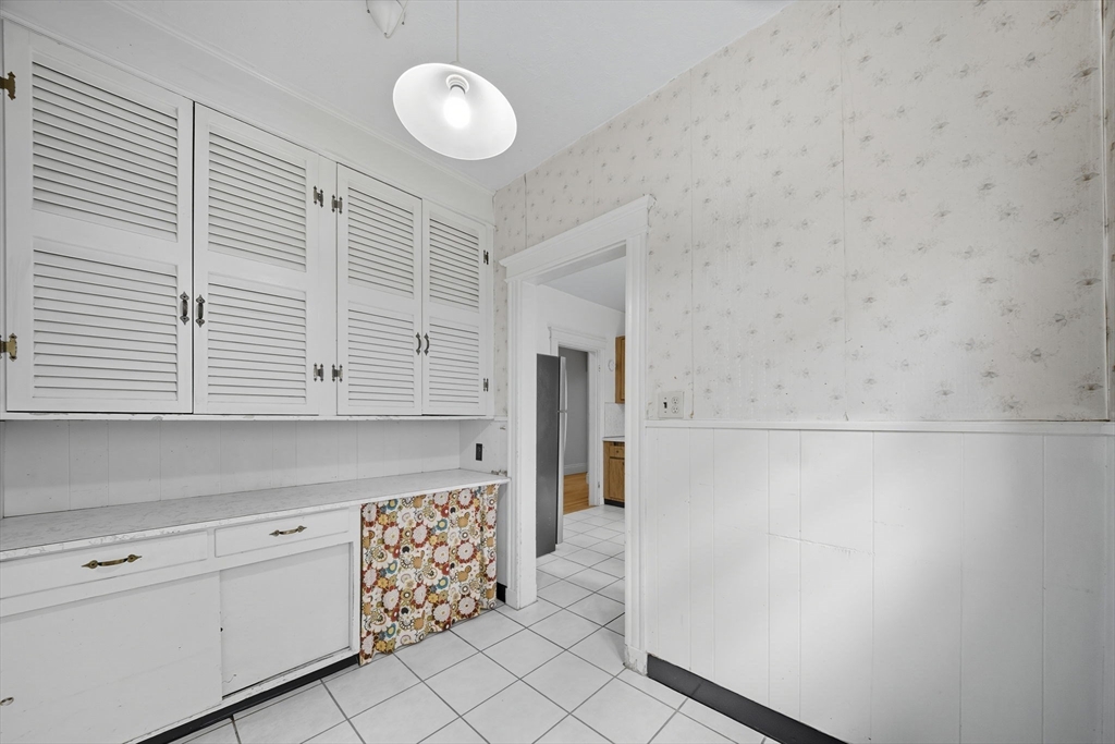 28 Verndale Street Brookline, MA 02446 - Photo 12 of 42 a kitchen with a cabinets and a stove