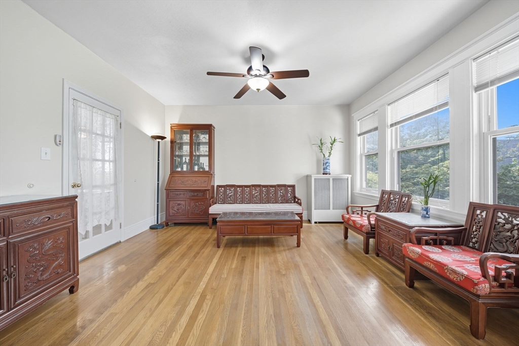 28 Verndale Street Brookline, MA 02446 - Photo 17 of 42 a living room with furniture and a fireplace
