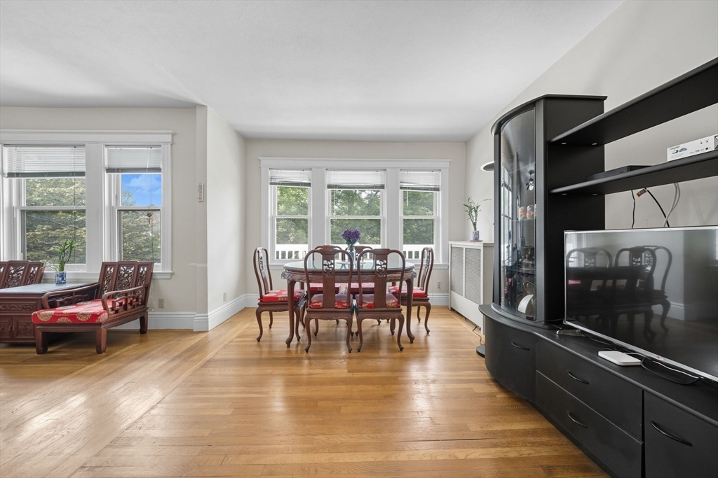 28 Verndale Street Brookline, MA 02446 - Photo 18 of 42 a dining room with furniture window and wooden floor