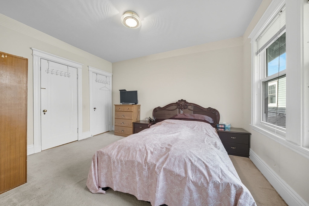 28 Verndale Street Brookline, MA 02446 - Photo 23 of 42 a bedroom with a bed and a window