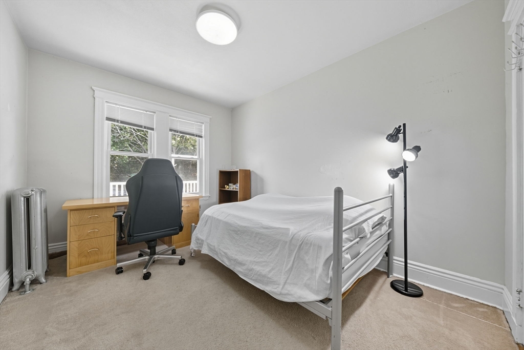 28 Verndale Street Brookline, MA 02446 - Photo 26 of 42 a bedroom with a bed and a chair