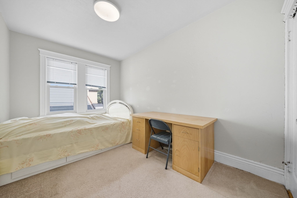 28 Verndale Street Brookline, MA 02446 - Photo 27 of 42 a spacious bedroom with a bed and a window