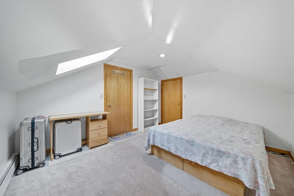 28 Verndale Street Brookline, MA 02446 - Photo 29 of 42 a spacious bedroom with a bed and a dresser