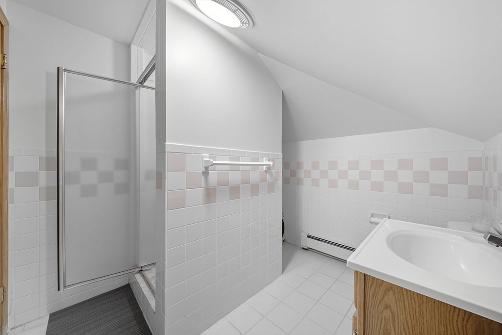 28 Verndale Street Brookline, MA 02446 - Photo 30 of 42 a bathroom with a sink and shower