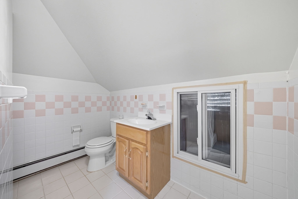 28 Verndale Street Brookline, MA 02446 - Photo 31 of 42 a bathroom with a toilet sink and mirror