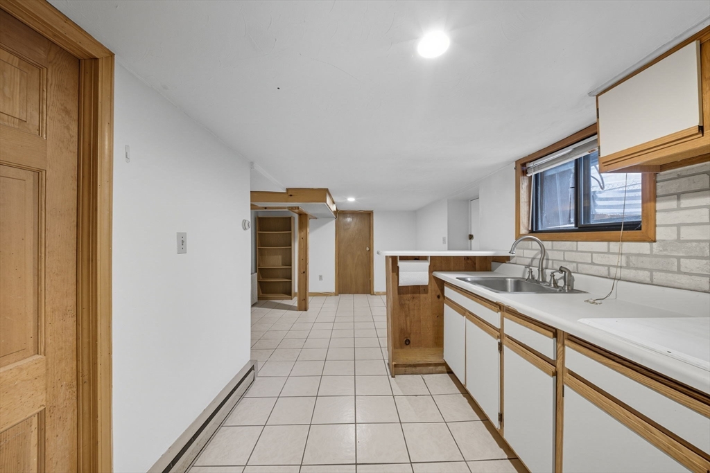 28 Verndale Street Brookline, MA 02446 - Photo 36 of 42 a kitchen with a sink and cabinets