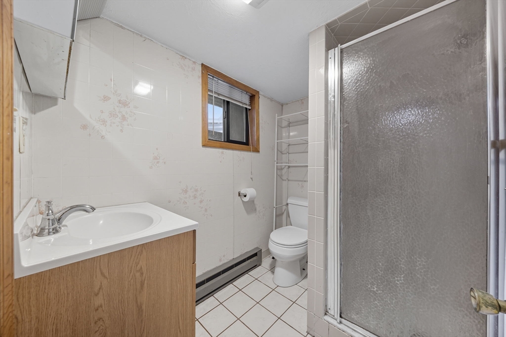 28 Verndale Street Brookline, MA 02446 - Photo 39 of 42 a bathroom with a sink toilet and shower