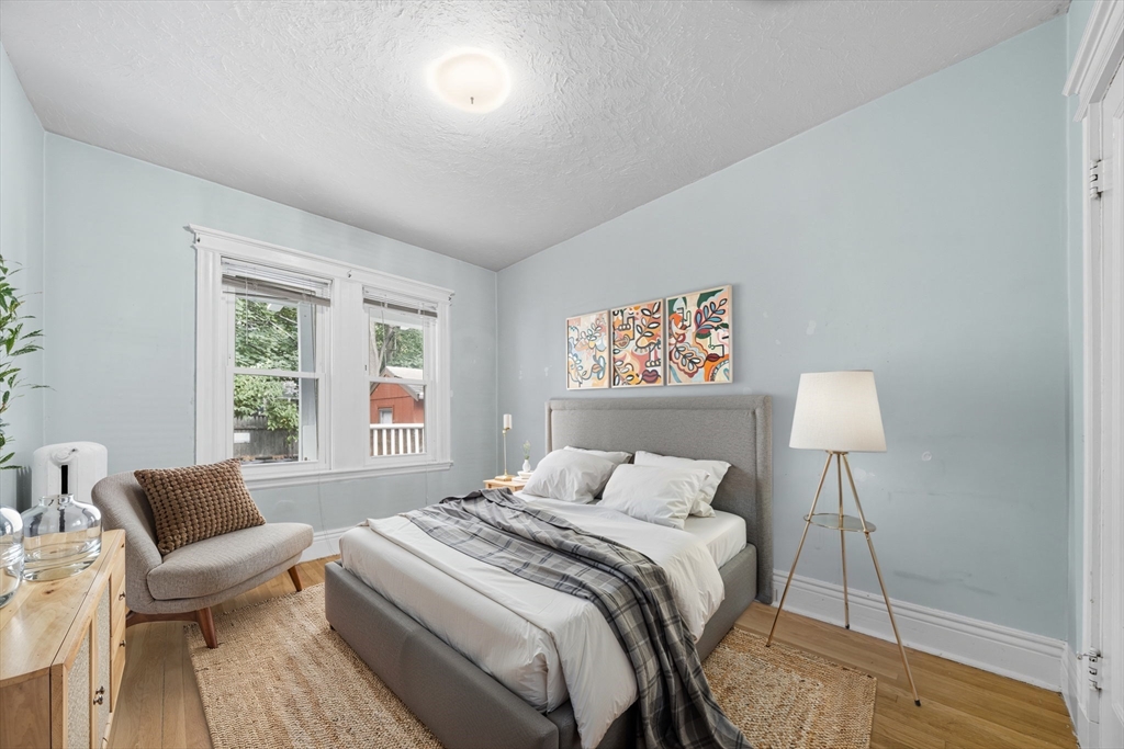 28 Verndale Street Brookline, MA 02446 - Photo 8 of 42 a bedroom with a bed and a lamp