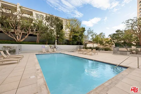 a view of a swimming pool with a patio