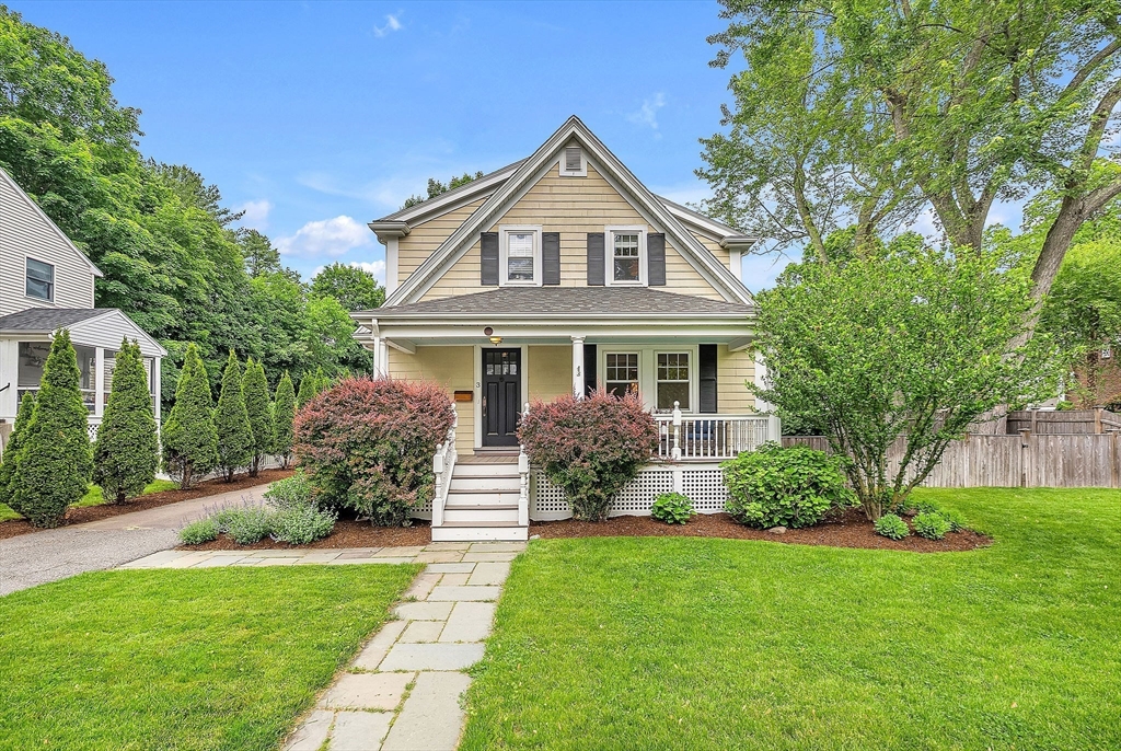 a front view of house with yard and green space