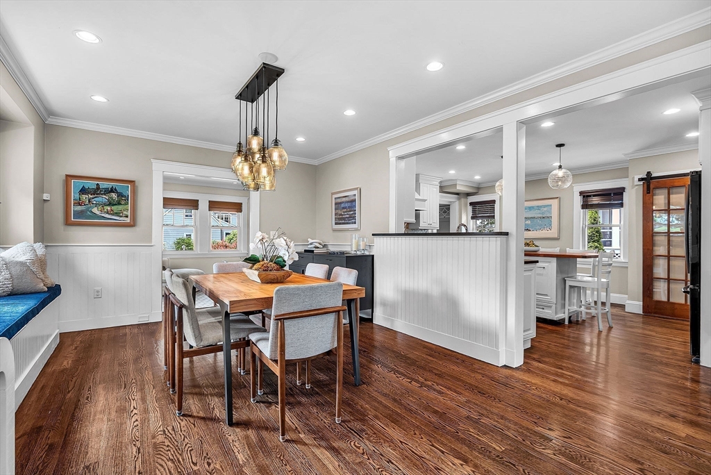 3 Thorpe Road Needham, MA 02494 - Photo 11 of 36 a dining room with wooden floor a chandelier a wooden table and chairs