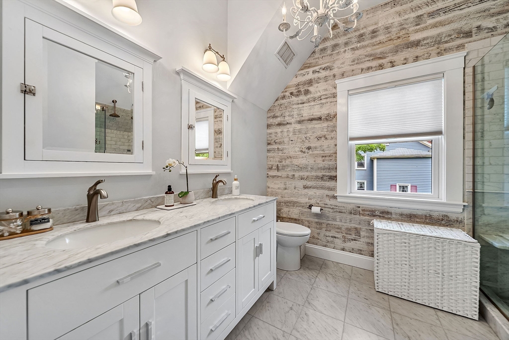 3 Thorpe Road Needham, MA 02494 - Photo 22 of 36 a bathroom with a sink double vanity and a bathtub