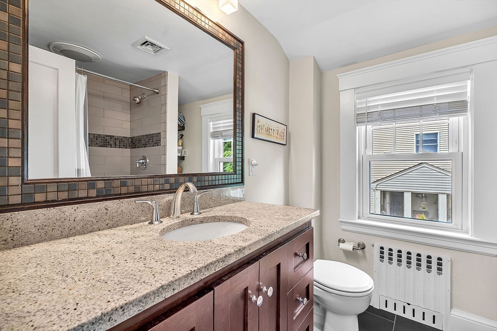 3 Thorpe Road Needham, MA 02494 - Photo 26 of 36 a bathroom with a granite countertop sink and a toilet