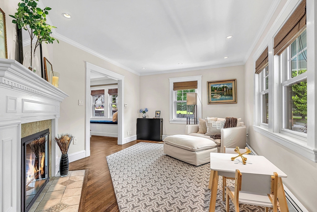 3 Thorpe Road Needham, MA 02494 - Photo 5 of 36 a living room with furniture a chandelier and a fireplace