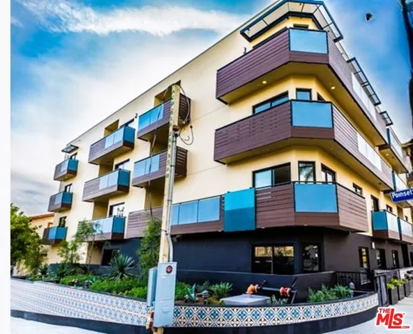 a front view of a multi story residential apartment building