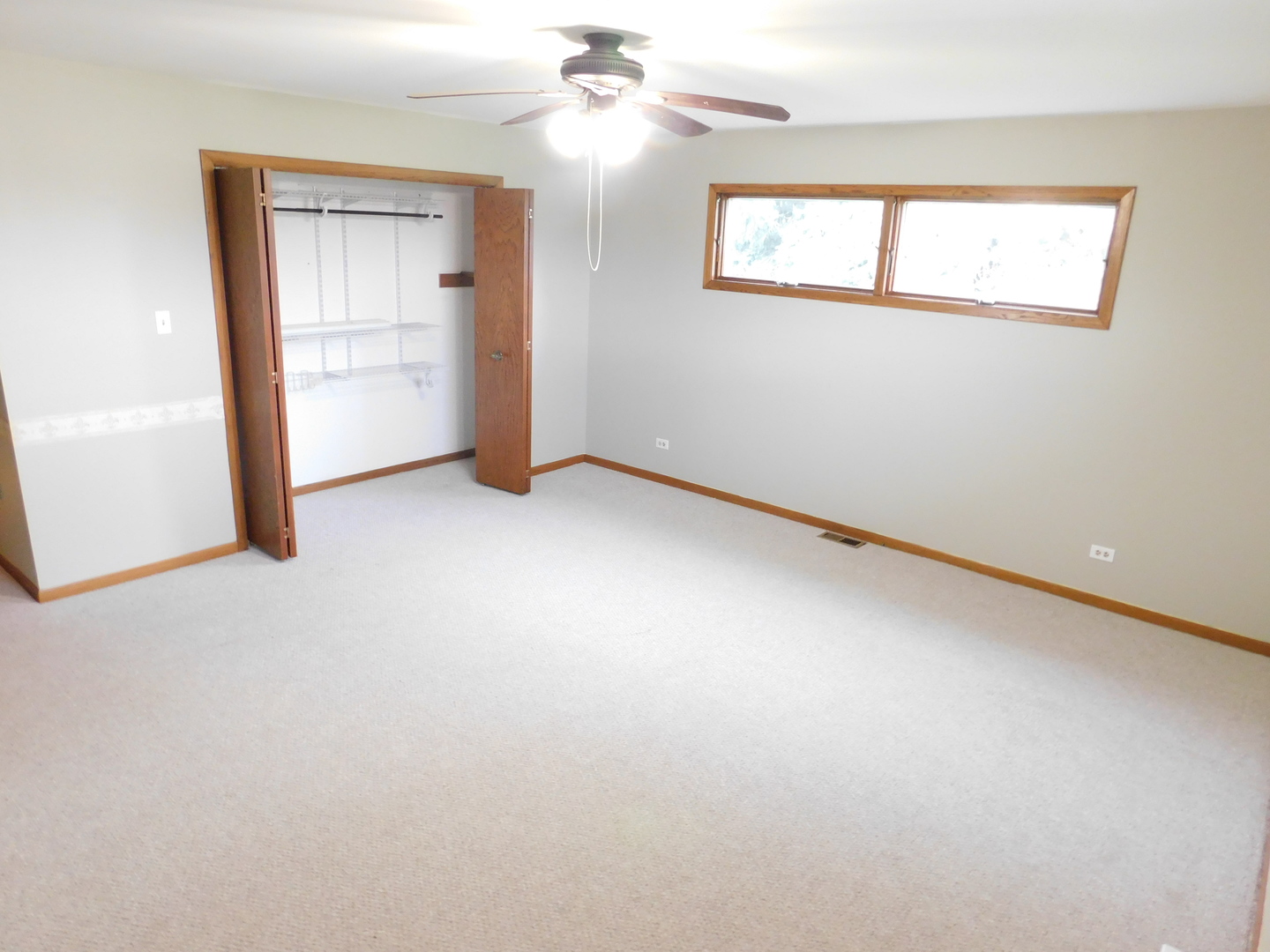 46W356 Jericho Road Big Rock, IL 60511 - Photo 22 of 33 an empty room with chandelier fan and windows