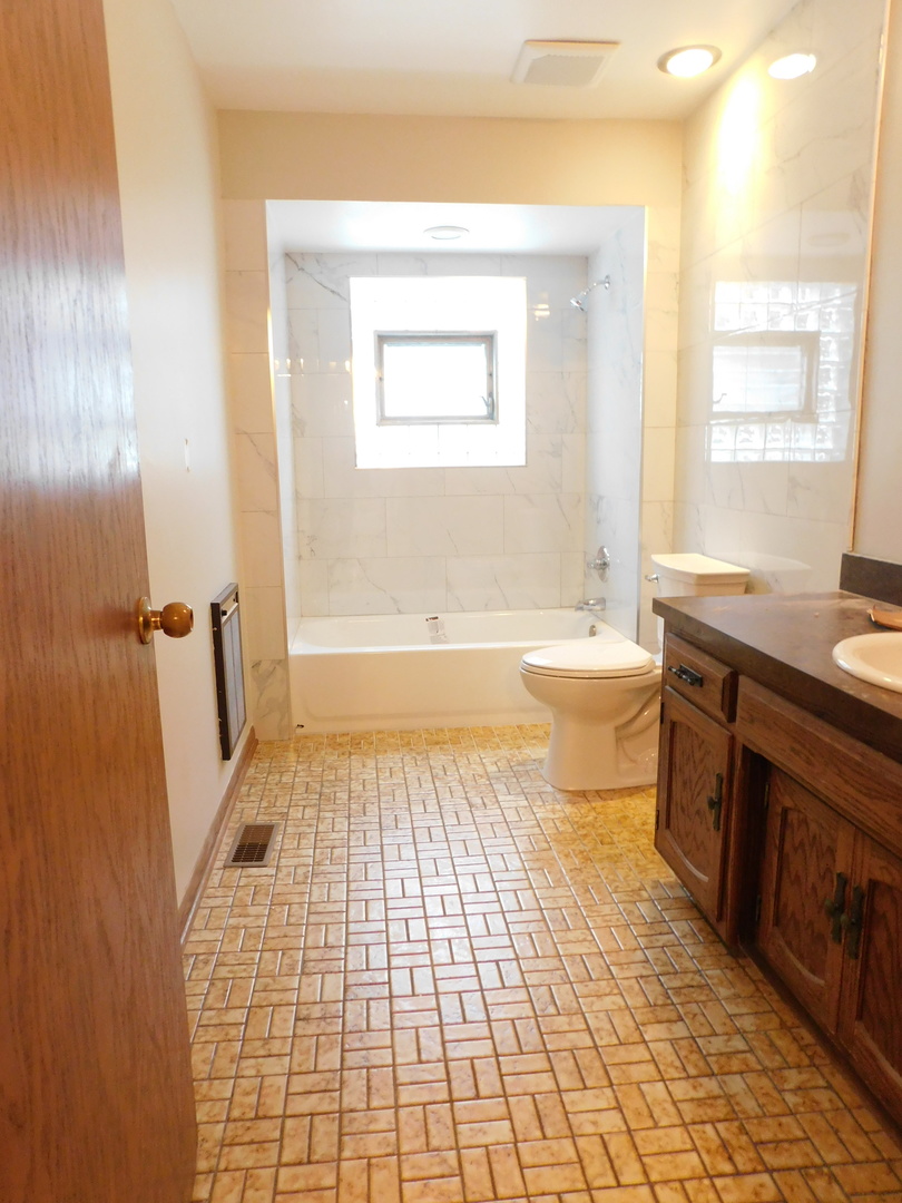 46W356 Jericho Road Big Rock, IL 60511 - Photo 26 of 33 a bathroom with a sink a toilet a window and shower