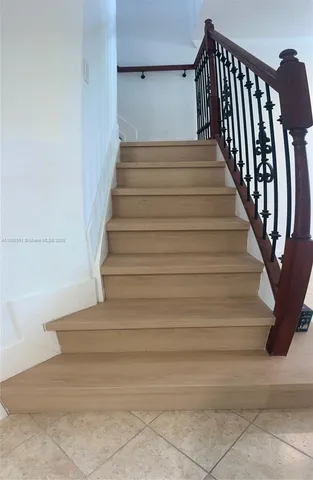 a view of a hallway with staircase