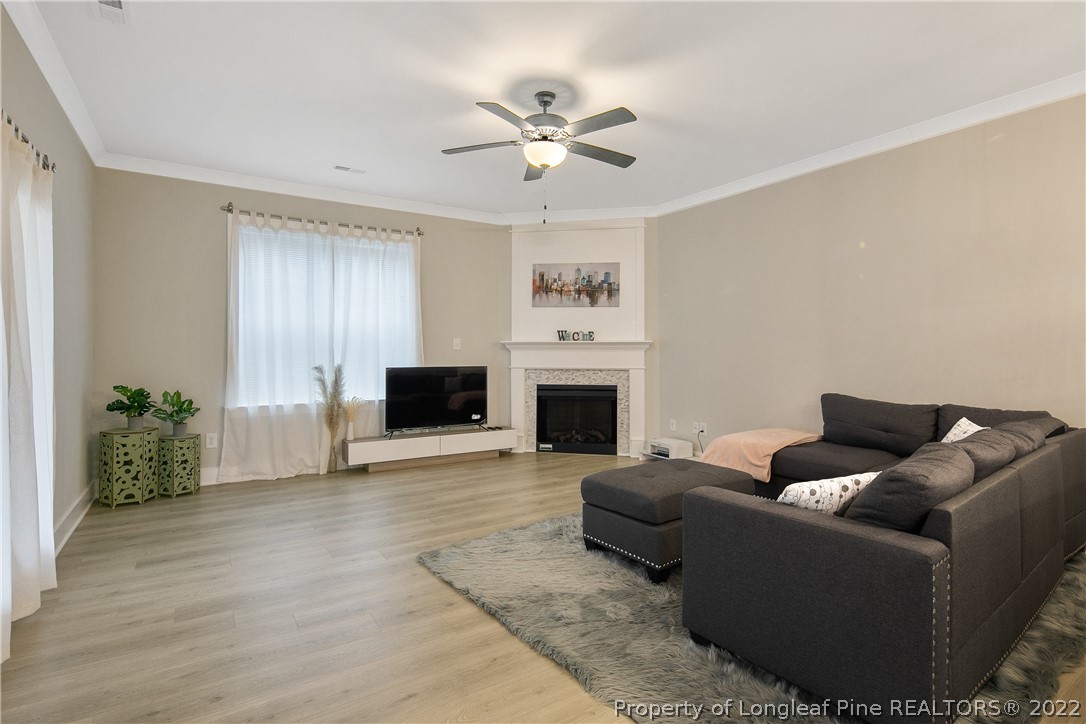 36 Spruce Hollow Circle Spring Lake, NC 28390 - Photo 16 of 49 a living room with furniture and a fireplace
