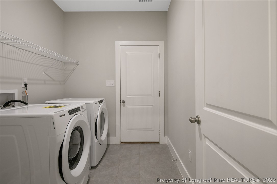 36 Spruce Hollow Circle Spring Lake, NC 28390 - Photo 21 of 49 a utility room with dryer and washer