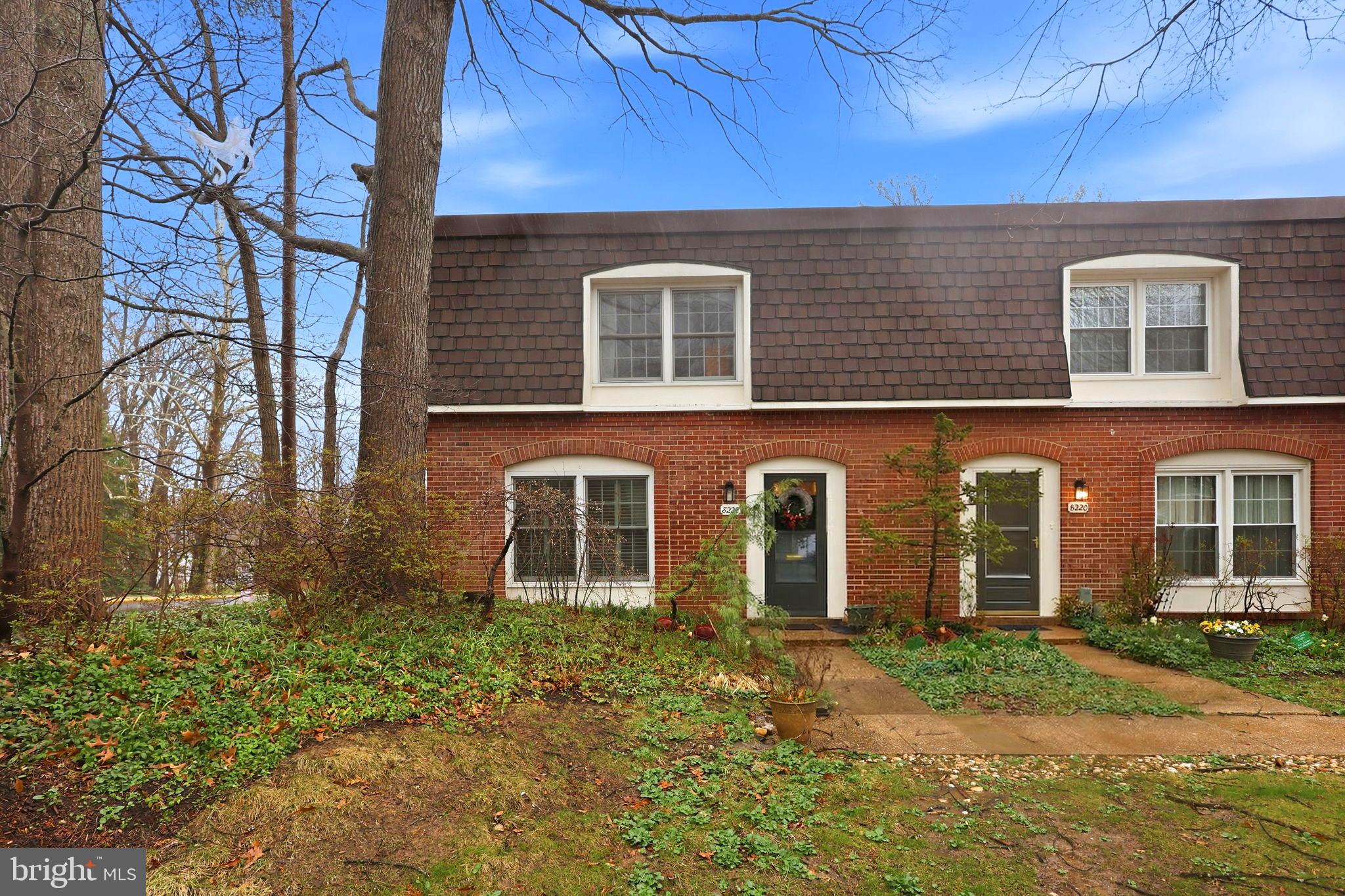 8222 Carrleigh Parkway, Unit 12 Springfield, VA 22152 - Photo 1 of 22 front view of a house with a yard