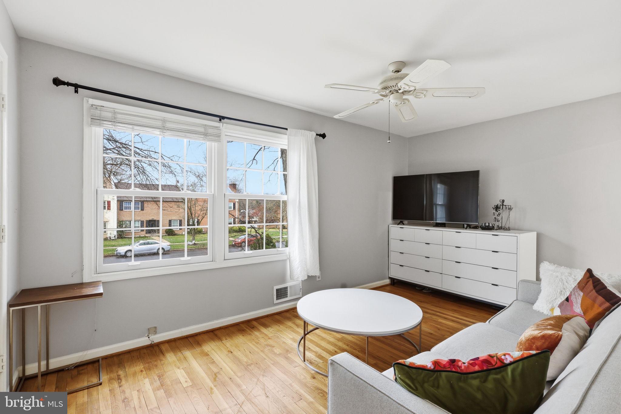 8222 Carrleigh Parkway, Unit 12 Springfield, VA 22152 - Photo 5 of 22 a living room with furniture and a flat screen tv
