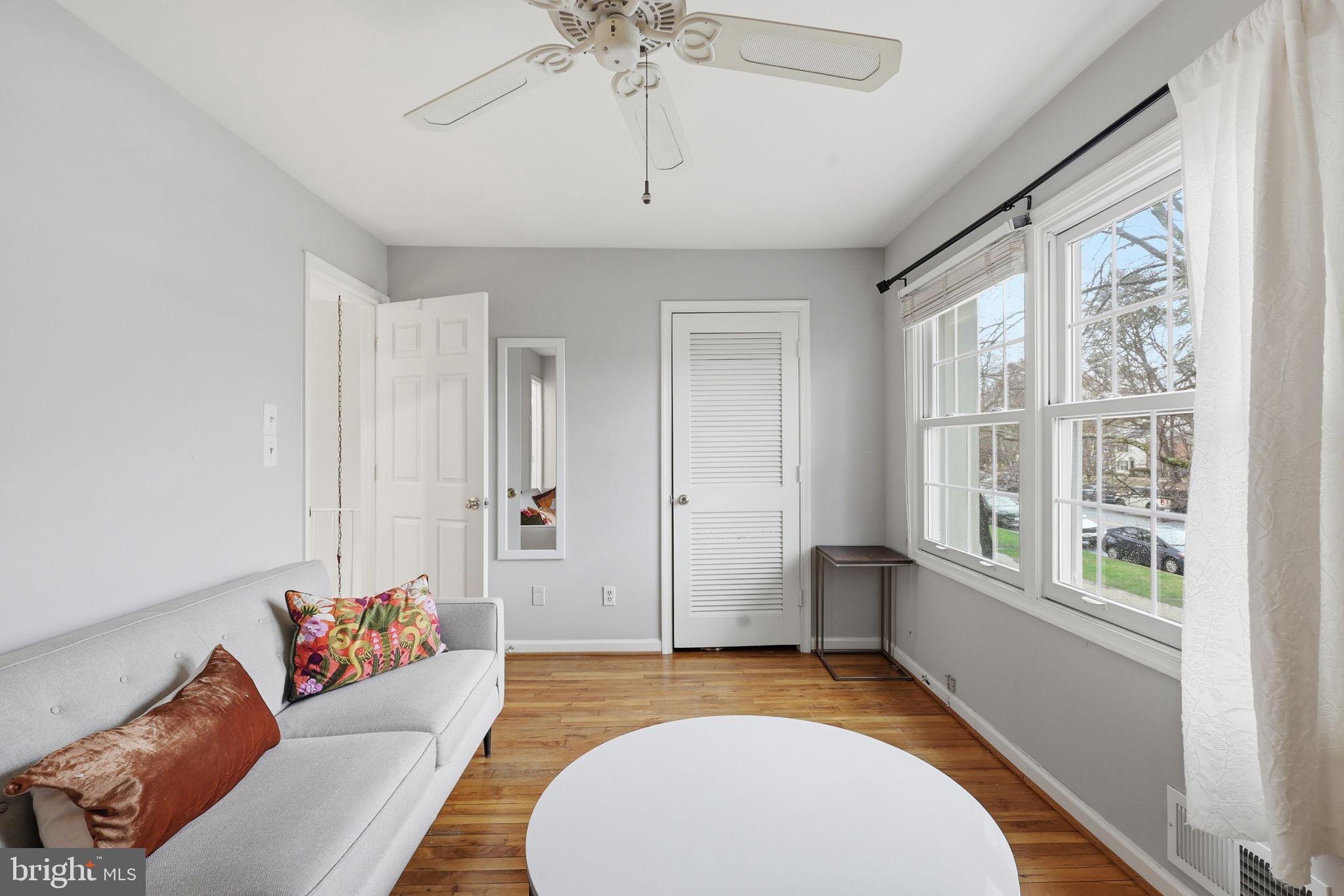 8222 Carrleigh Parkway, Unit 12 Springfield, VA 22152 - Photo 7 of 22 a living room with furniture and a chandelier