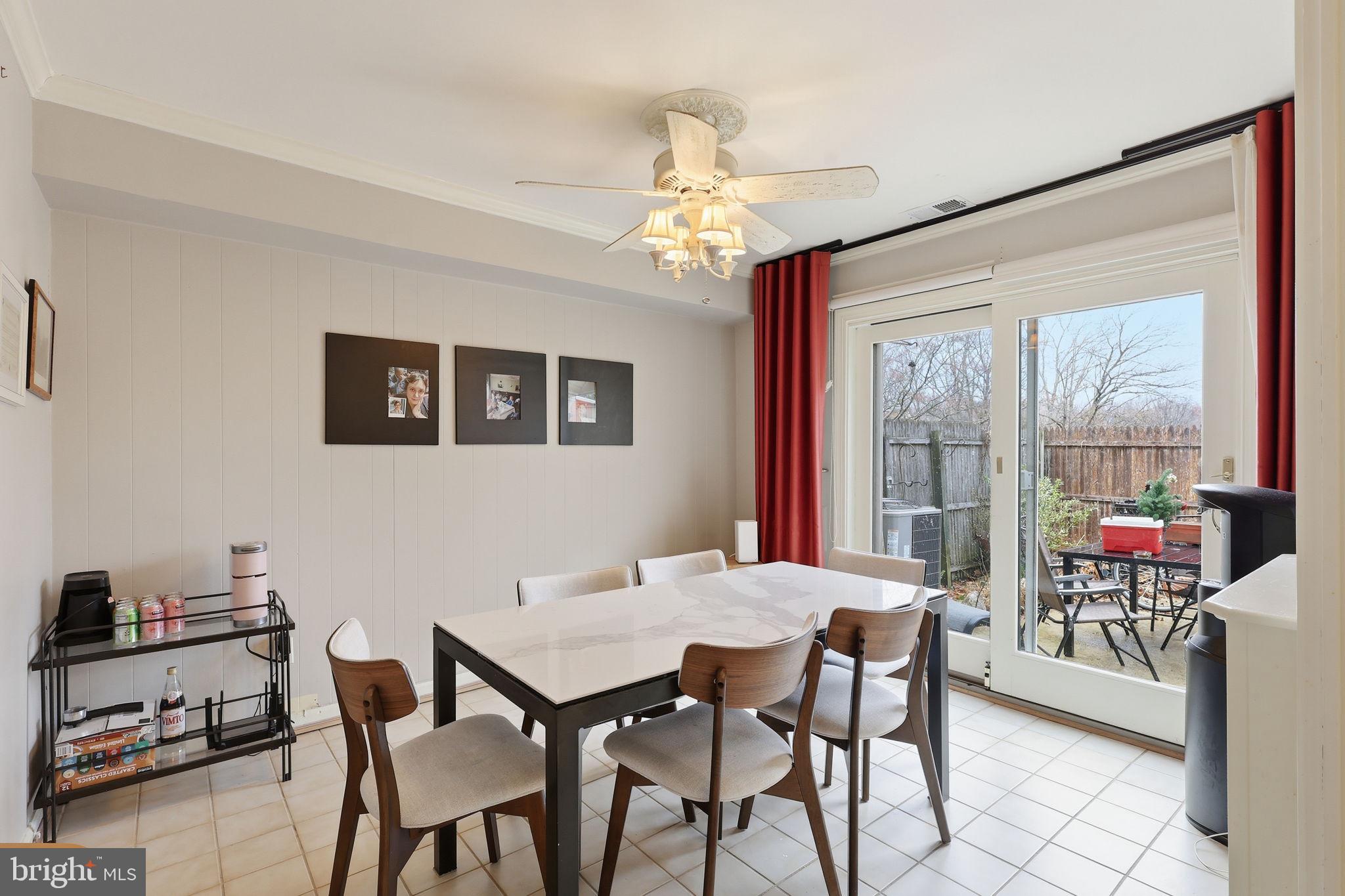 8222 Carrleigh Parkway, Unit 12 Springfield, VA 22152 - Photo 9 of 22 a view of a dining room with furniture window and outside view