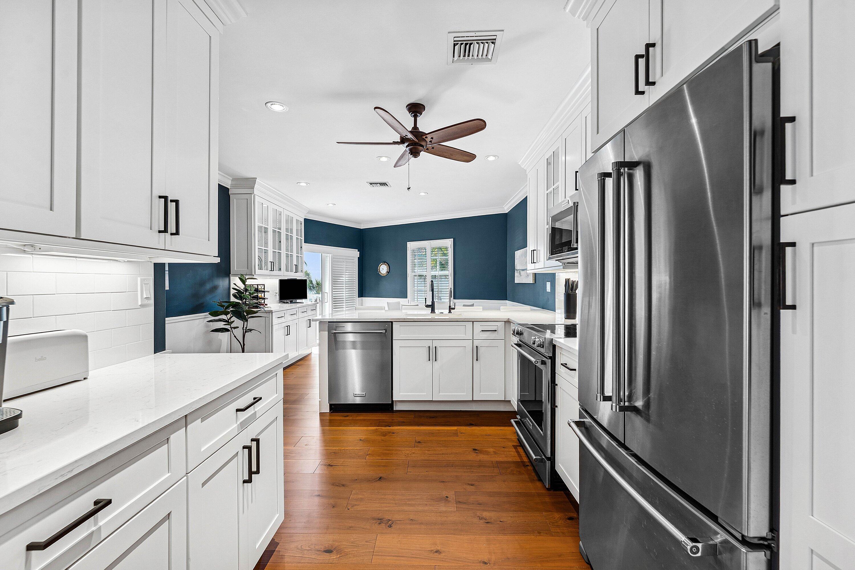 5900 Old Ocean Boulevard, Unit C4 Ocean Ridge, FL 33435 - Photo 12 of 25 a kitchen with a refrigerator sink and stove